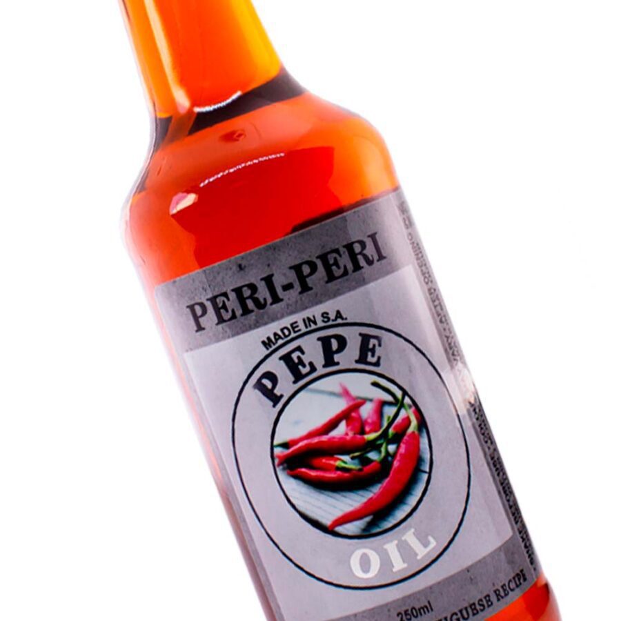 Pepe Peri-Peri Oil - spicy chilli-infused oil ideal for cooking or marinating. Close up.