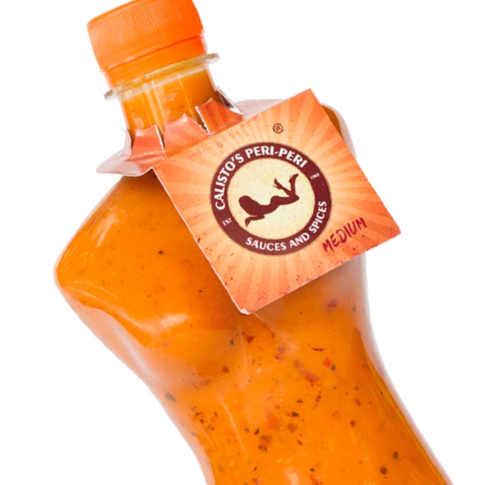 senhoritamedium zoom sml Calisto’s Senhorita Peri–Peri Sauce - Medium - medium-heat peri-peri sauce in a unique woman-shaped bottle. Close up.