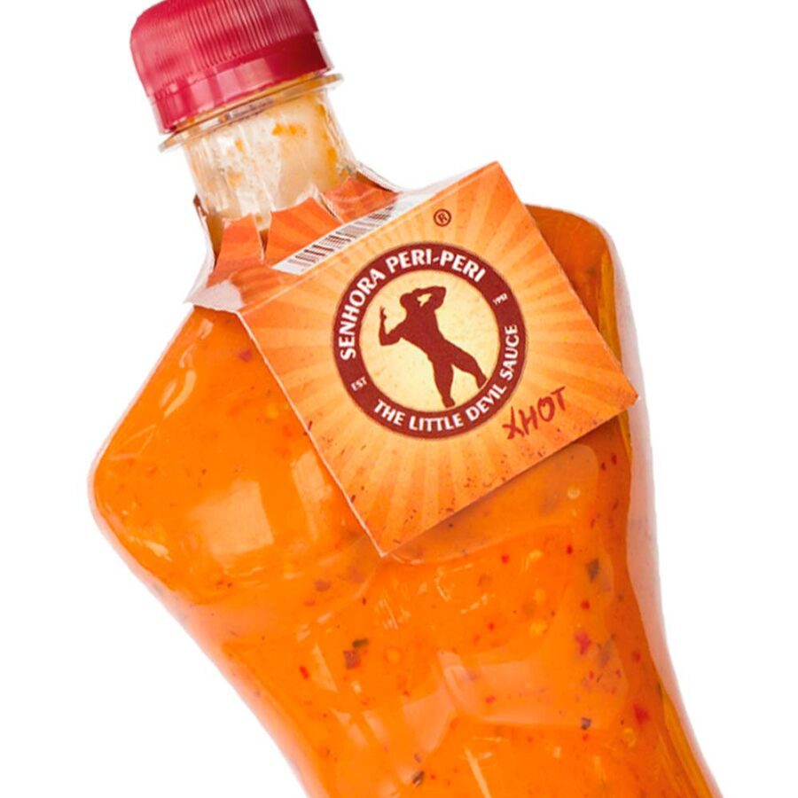 Calisto’s Senhor Peri-Peri Sauce – Extra Hot – fiery peri-peri sauce in a bold male-shaped bottle. Close up.